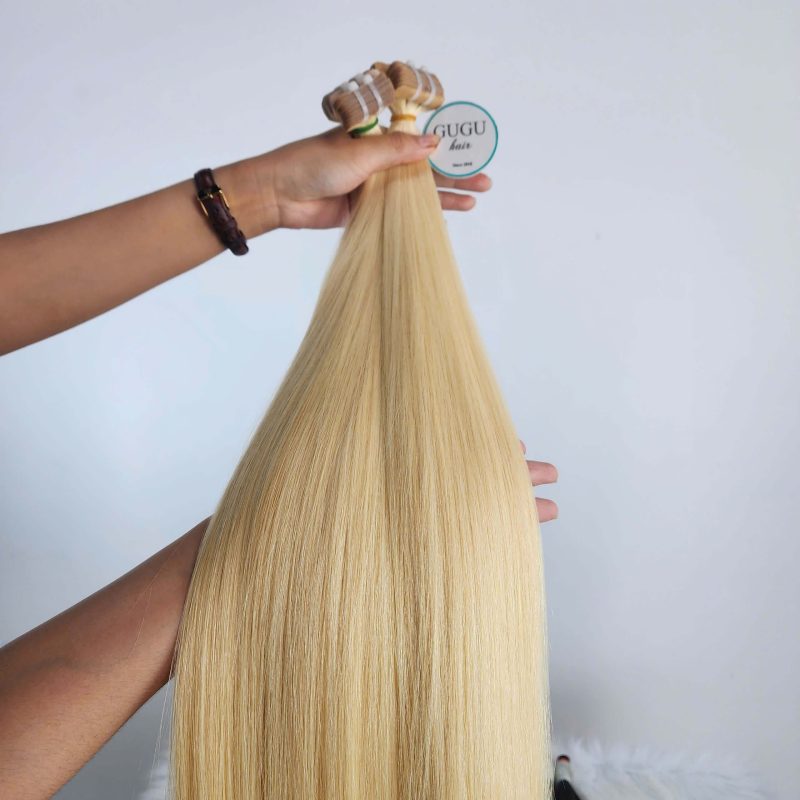 Tape-in hair extensions with 100% raw human hair