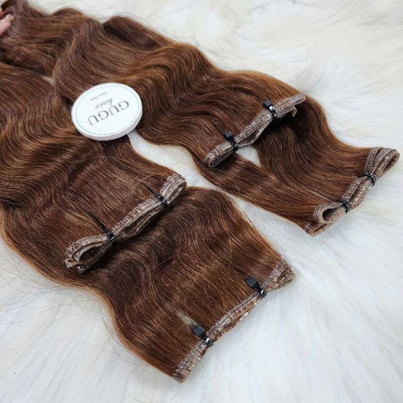 Brown wavy Genius Weft human hair extensions