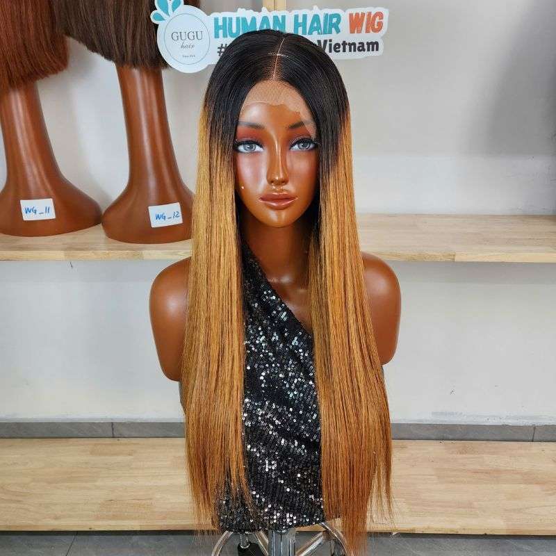 Ombre straight human hair wig with dark roots and honey brown lengths, back view